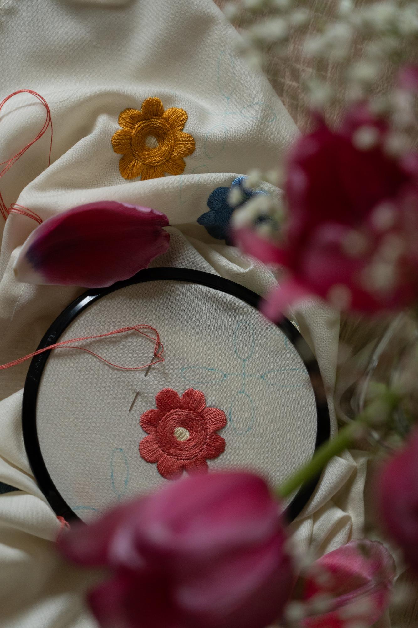 Close-up of embroidered linen with floral motif